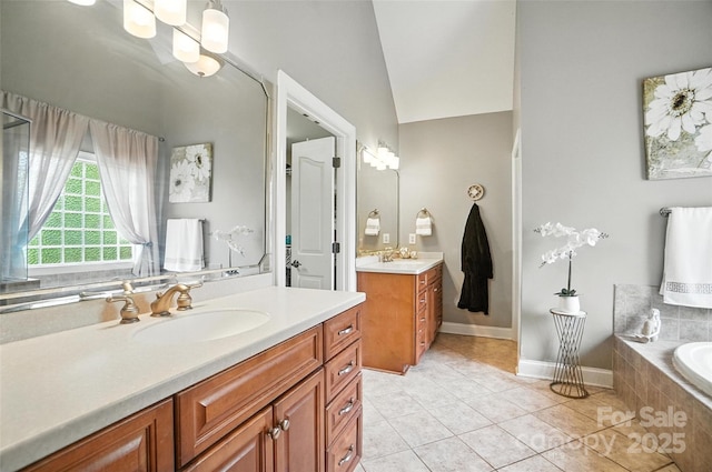 5916 Four Wood Dr, Matthews, NC 28104 - full bath featuring two vanities, tile patterned floors, and a garden tub