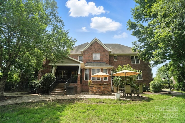 5916 Four Wood Dr, Matthews, NC 28104 - rear view of house featuring a yard, brick siding, and a patio area