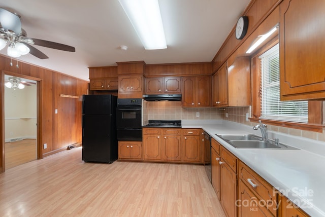 5720 Amity Pl, Charlotte, NC 28212 - kitchen featuring black appliances, a warming drawer, brown cabinets, ceiling fan, and light wood-style flooring