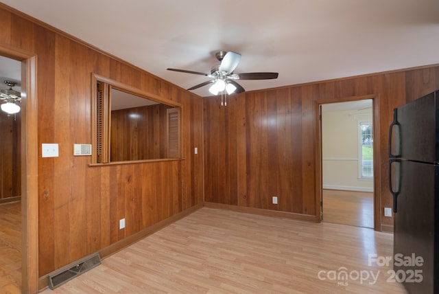 5720 Amity Pl, Charlotte, NC 28212 - empty room featuring ceiling fan, wooden walls, and wood finished floors