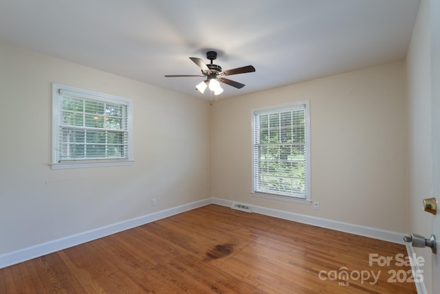 5720 Amity Pl, Charlotte, NC 28212 - spare room featuring wood finished floors and a ceiling fan