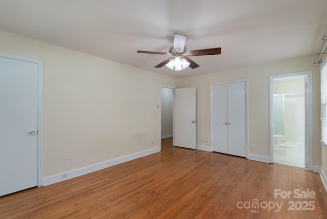 5720 Amity Pl, Charlotte, NC 28212 - unfurnished bedroom featuring wood finished floors, ensuite bath, and ceiling fan