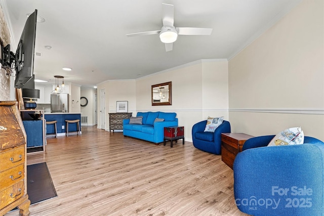 1038 SW Dr, Davidson, NC 28036 - sitting room featuring crown molding, a ceiling fan, and light wood-style flooring