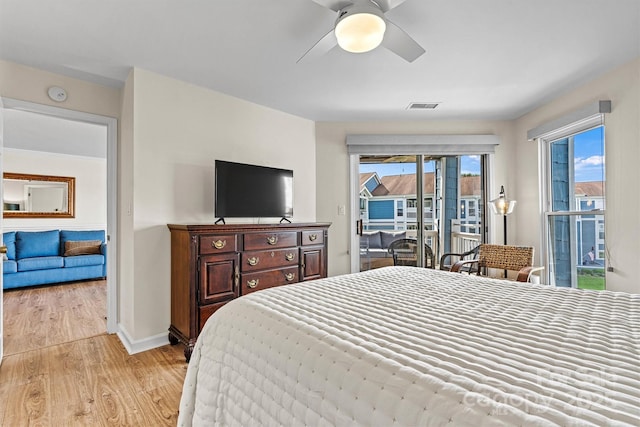1038 SW Dr, Davidson, NC 28036 - bedroom with access to exterior, light wood-type flooring, and a ceiling fan