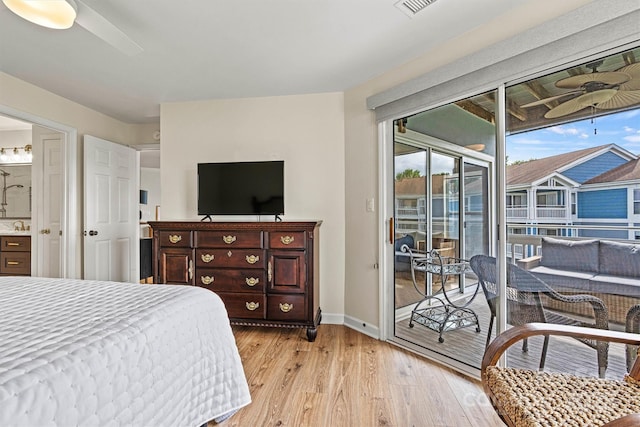 1038 SW Dr, Davidson, NC 28036 - bedroom with access to outside, light wood finished floors, and ensuite bathroom