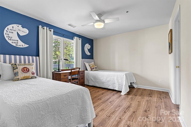 1038 SW Dr, Davidson, NC 28036 - bedroom with wood finished floors and ceiling fan