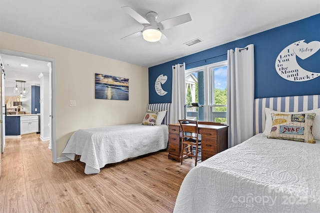 1038 SW Dr, Davidson, NC 28036 - bedroom featuring light wood-type flooring and a ceiling fan