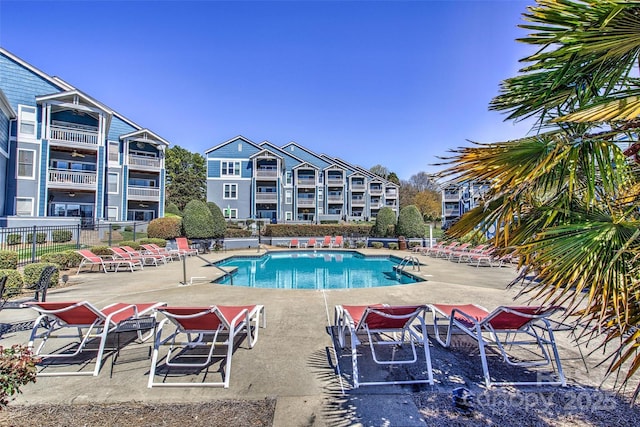 1038 SW Dr, Davidson, NC 28036 - community pool featuring a patio area