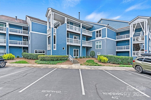 1038 SW Dr, Davidson, NC 28036 - view of building exterior with uncovered parking