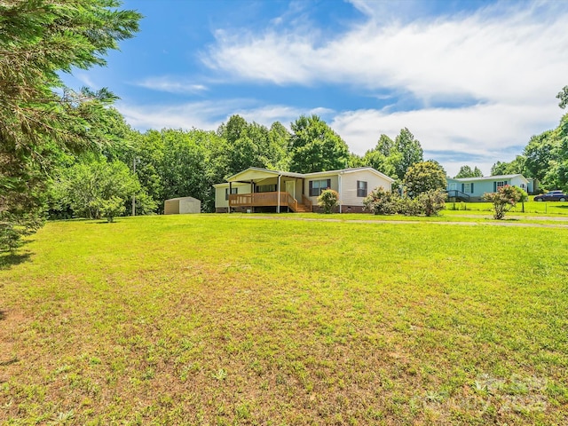 4591 Scott Rd, Morganton, NC 28655 - view of green lawn featuring a deck