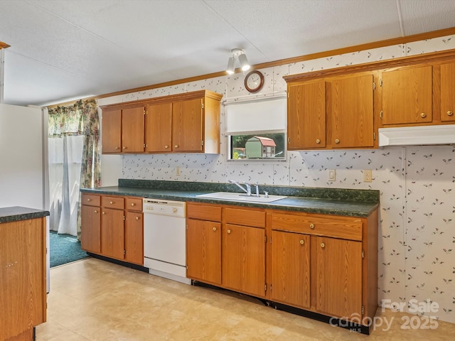 4591 Scott Rd, Morganton, NC 28655 - kitchen featuring dishwasher, a sink, brown cabinetry, dark countertops, and light flooring