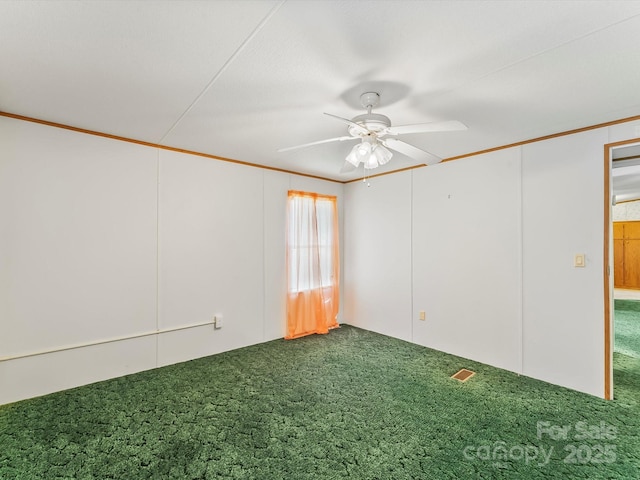 4591 Scott Rd, Morganton, NC 28655 - spare room featuring dark colored carpet, a ceiling fan, and ornamental molding