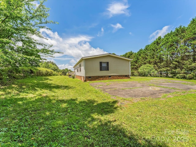 4591 Scott Rd, Morganton, NC 28655 - view of side of home featuring crawl space and a yard