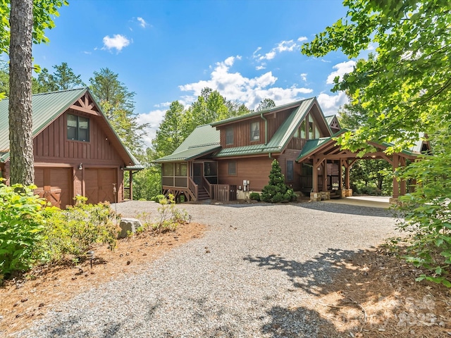 1526 Pisgah Preserve Dr Unit 7-8, Nebo, NC 28761 - view of front of property featuring driveway, a metal roof, and board and batten siding