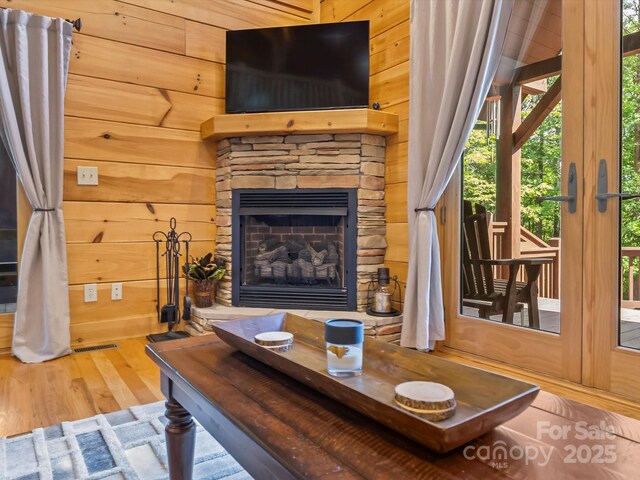 1526 Pisgah Preserve Dr Unit 7-8, Nebo, NC 28761 - living room featuring wood finished floors, wooden walls, and a fireplace