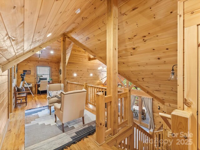 1526 Pisgah Preserve Dr Unit 7-8, Nebo, NC 28761 - living area featuring wooden ceiling, lofted ceiling, wood walls, an upstairs landing, and wood finished floors