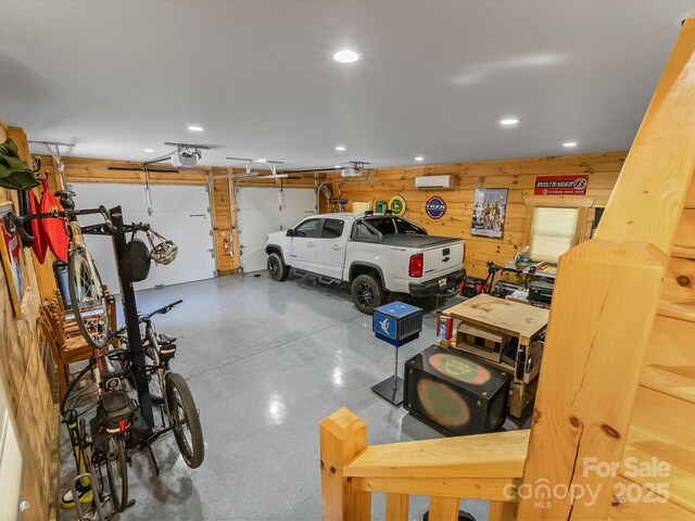 1526 Pisgah Preserve Dr Unit 7-8, Nebo, NC 28761 - garage with a garage door opener, wood walls, recessed lighting, and a wall mounted AC