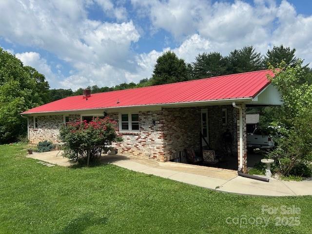 135 Smathers St, Clyde, NC 28721 - back of house with a yard and metal roof