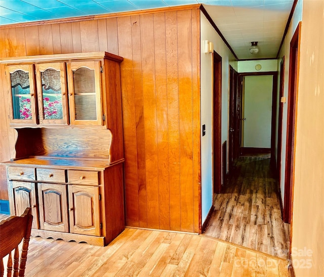 135 Smathers St, Clyde, NC 28721 - hallway with light wood-type flooring, wooden walls, and crown molding