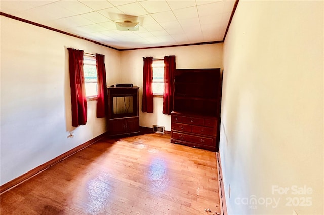 135 Smathers St, Clyde, NC 28721 - unfurnished room featuring crown molding, wood finished floors, and baseboards