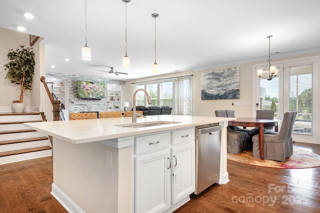16324 Loch Raven Rd, Huntersville, NC 28078 - kitchen featuring stainless steel dishwasher, dark wood-style floors, crown molding, hanging light fixtures, and white cabinetry