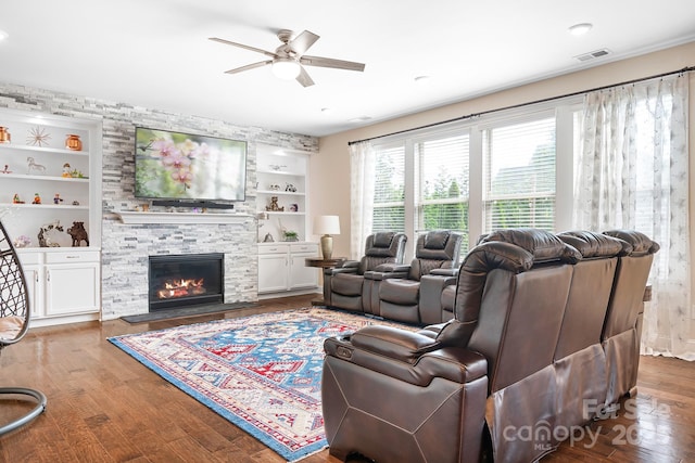 16324 Loch Raven Rd, Huntersville, NC 28078 - living room featuring ceiling fan, a stone fireplace, wood finished floors, and built in features