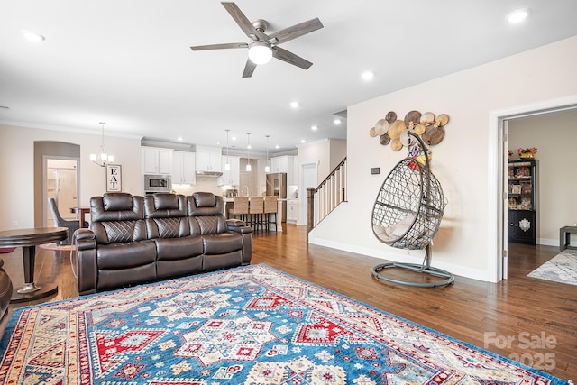 16324 Loch Raven Rd, Huntersville, NC 28078 - living room featuring a ceiling fan, stairs, wood finished floors, recessed lighting, and crown molding