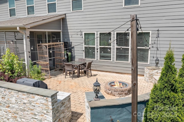 16324 Loch Raven Rd, Huntersville, NC 28078 - view of patio / terrace with a fire pit, outdoor dining area, and an outdoor kitchen