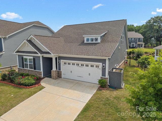 4427 Poplin Grove Dr, Indian Trail, NC 28079 - craftsman-style house featuring driveway, stone siding, and a shingled roof