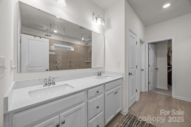 4427 Poplin Grove Dr, Indian Trail, NC 28079 - full bath with a tile shower, double vanity, recessed lighting, baseboards, and a spacious closet