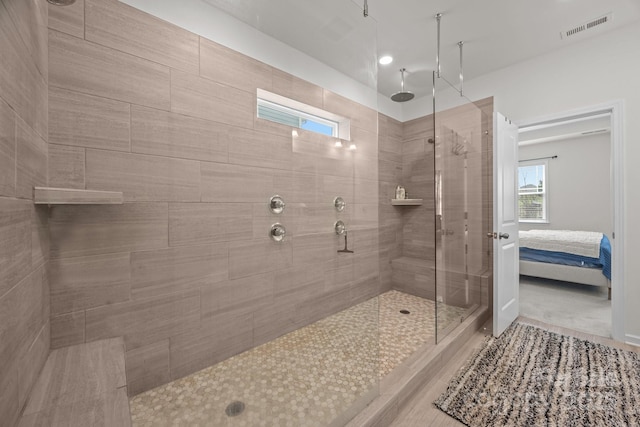 4427 Poplin Grove Dr, Indian Trail, NC 28079 - bathroom with a tile shower, connected bathroom, and wood finished floors