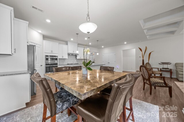 4427 Poplin Grove Dr, Indian Trail, NC 28079 - dining room with wood finished floors, recessed lighting, and baseboards