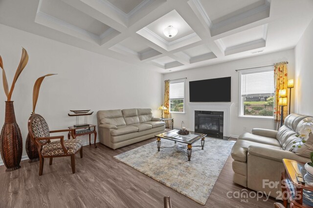 4427 Poplin Grove Dr, Indian Trail, NC 28079 - living room featuring beamed ceiling, wood finished floors, a fireplace with flush hearth, baseboards, and coffered ceiling