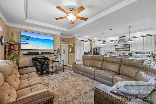 381 US-70 Hwy, Black Mountain, NC 28711 - living room with a raised ceiling, ceiling fan, ornamental molding, baseboards, and wood finished floors