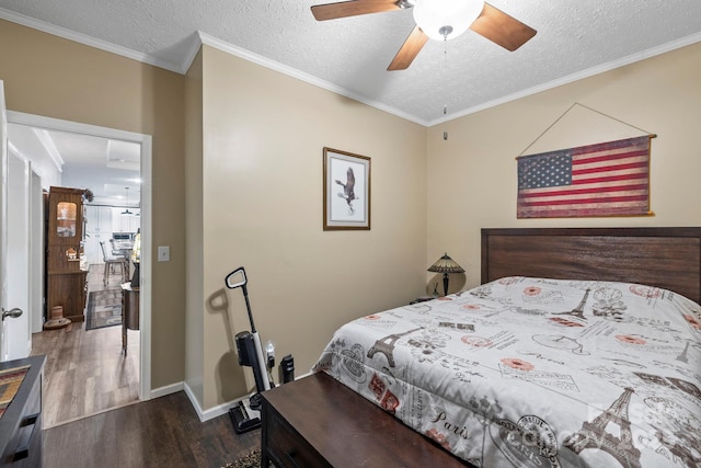 381 US-70 Hwy, Black Mountain, NC 28711 - bedroom with dark wood finished floors, a textured ceiling, ceiling fan, ornamental molding, and baseboards
