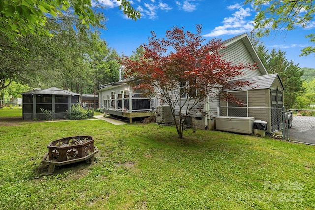 381 US-70 Hwy, Black Mountain, NC 28711 - rear view of house with a fire pit, a sunroom, and a wooden deck