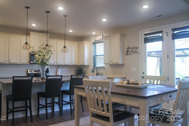 858 Oak Manor Dr SE, Concord, NC 28025 - dining area with recessed lighting and dark wood-type flooring