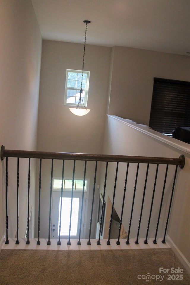 858 Oak Manor Dr SE, Concord, NC 28025 - stairs featuring a chandelier and carpet