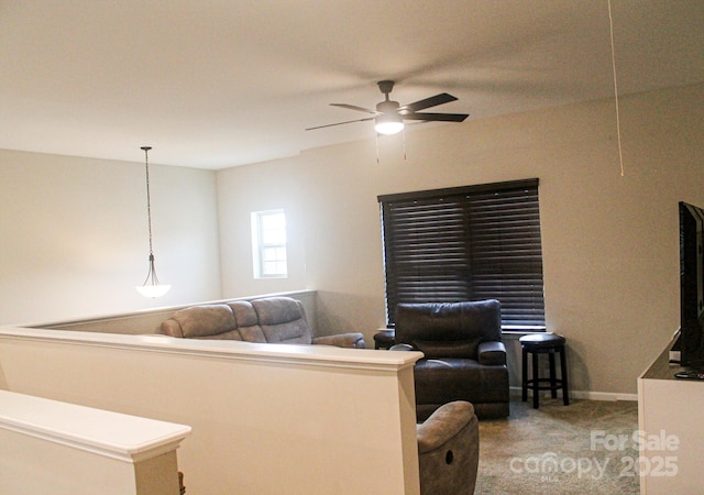 858 Oak Manor Dr SE, Concord, NC 28025 - carpeted living room featuring ceiling fan and baseboards