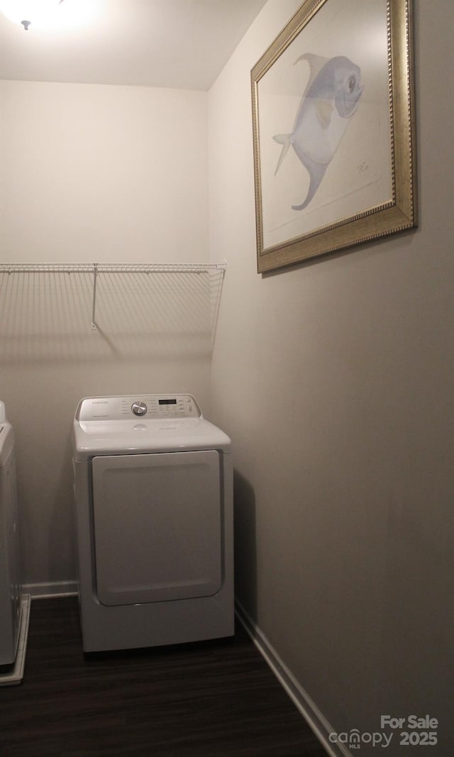858 Oak Manor Dr SE, Concord, NC 28025 - laundry area featuring washing machine and dryer and dark wood finished floors