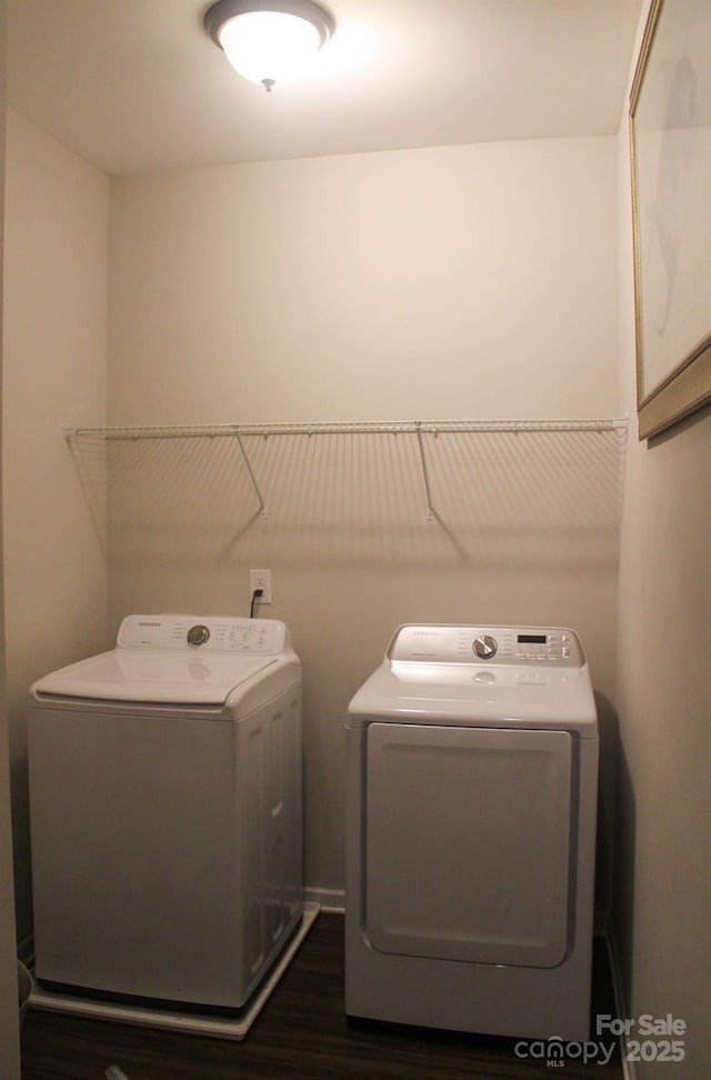 858 Oak Manor Dr SE, Concord, NC 28025 - washroom featuring separate washer and dryer and dark wood-style flooring