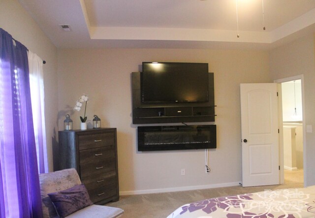 858 Oak Manor Dr SE, Concord, NC 28025 - carpeted bedroom with a raised ceiling and baseboards