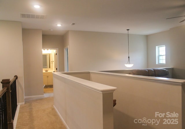 858 Oak Manor Dr SE, Concord, NC 28025 - hall featuring an upstairs landing, recessed lighting, and light colored carpet