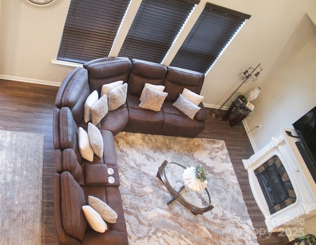858 Oak Manor Dr SE, Concord, NC 28025 - living room featuring baseboards and wood finished floors