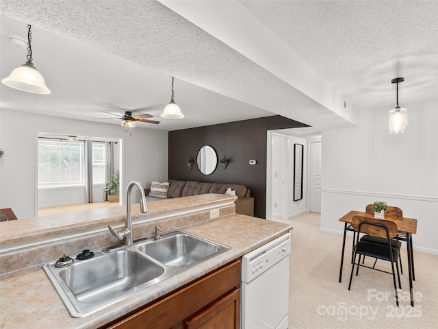 91 Morningside Ln, Hendersonville, NC 28792 - kitchen with dishwasher, a textured ceiling, decorative light fixtures, brown cabinets, and light countertops