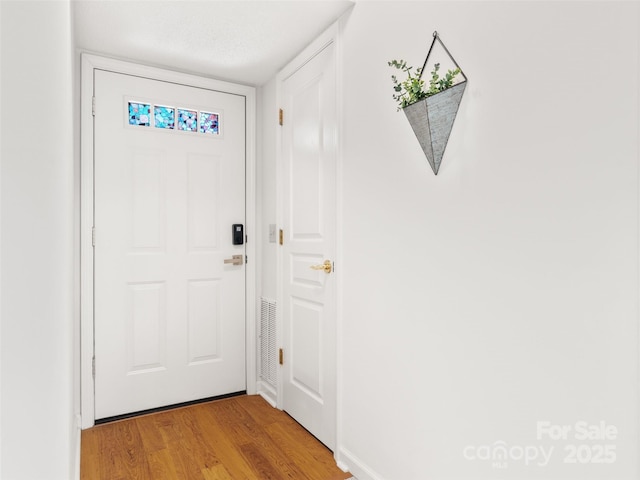 91 Morningside Ln, Hendersonville, NC 28792 - doorway with light wood-type flooring and baseboards