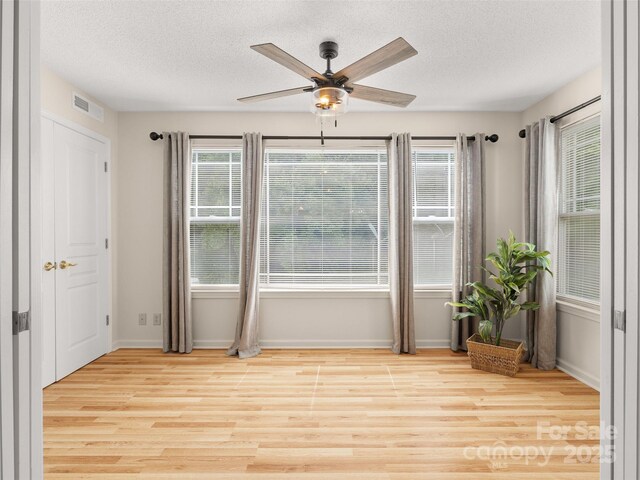 91 Morningside Ln, Hendersonville, NC 28792 - spare room with ceiling fan, a textured ceiling, and light wood finished floors