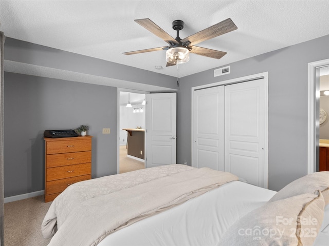 91 Morningside Ln, Hendersonville, NC 28792 - bedroom featuring a closet, carpet, ceiling fan, and a textured ceiling