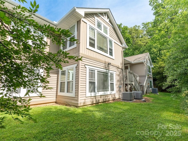 91 Morningside Ln, Hendersonville, NC 28792 - rear view of house featuring stairway and a yard