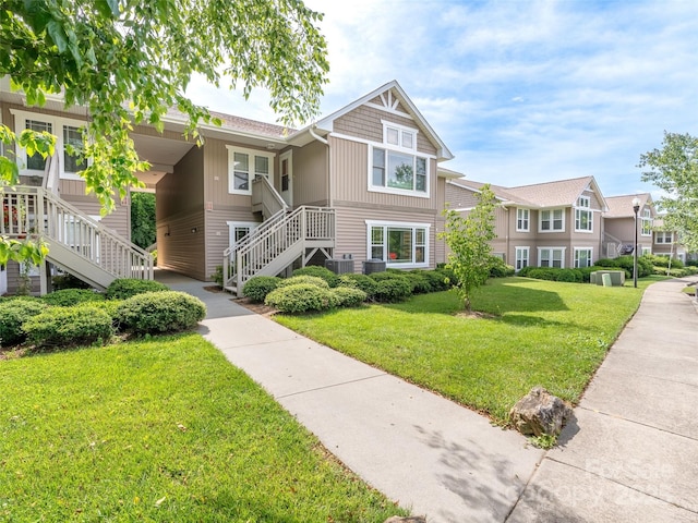 91 Morningside Ln, Hendersonville, NC 28792 - view of front facade featuring stairway and a front yard